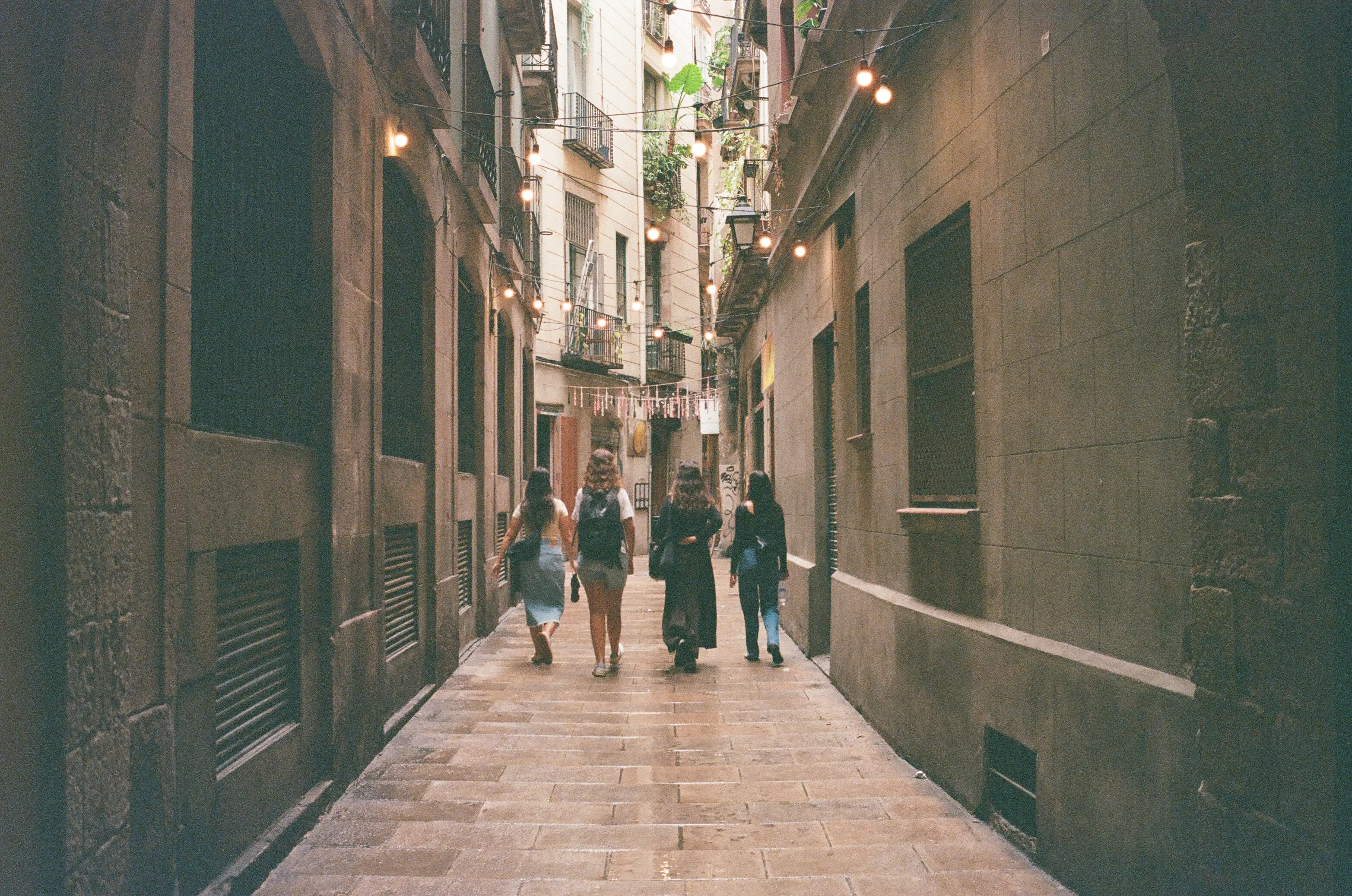 Film photograph from Spain, titled "barca ppl walking".